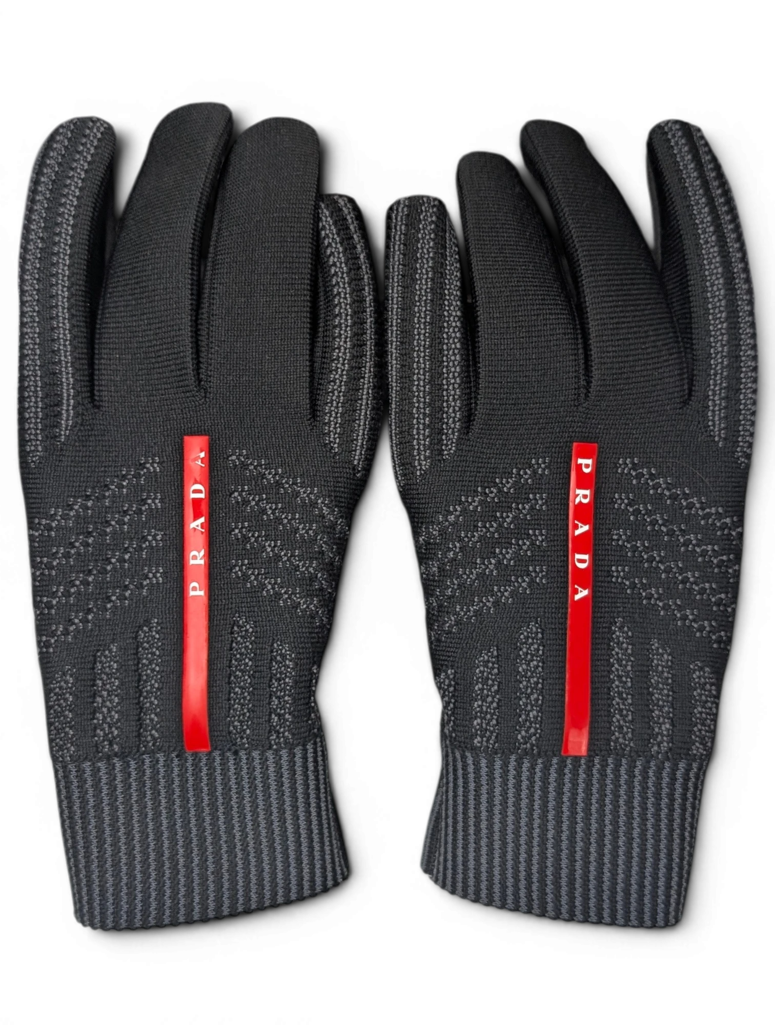 JAKE & IPI black Reusch for Prada knit gloves with red logo stripe and ribbed cuffs in a recycled cardboard box