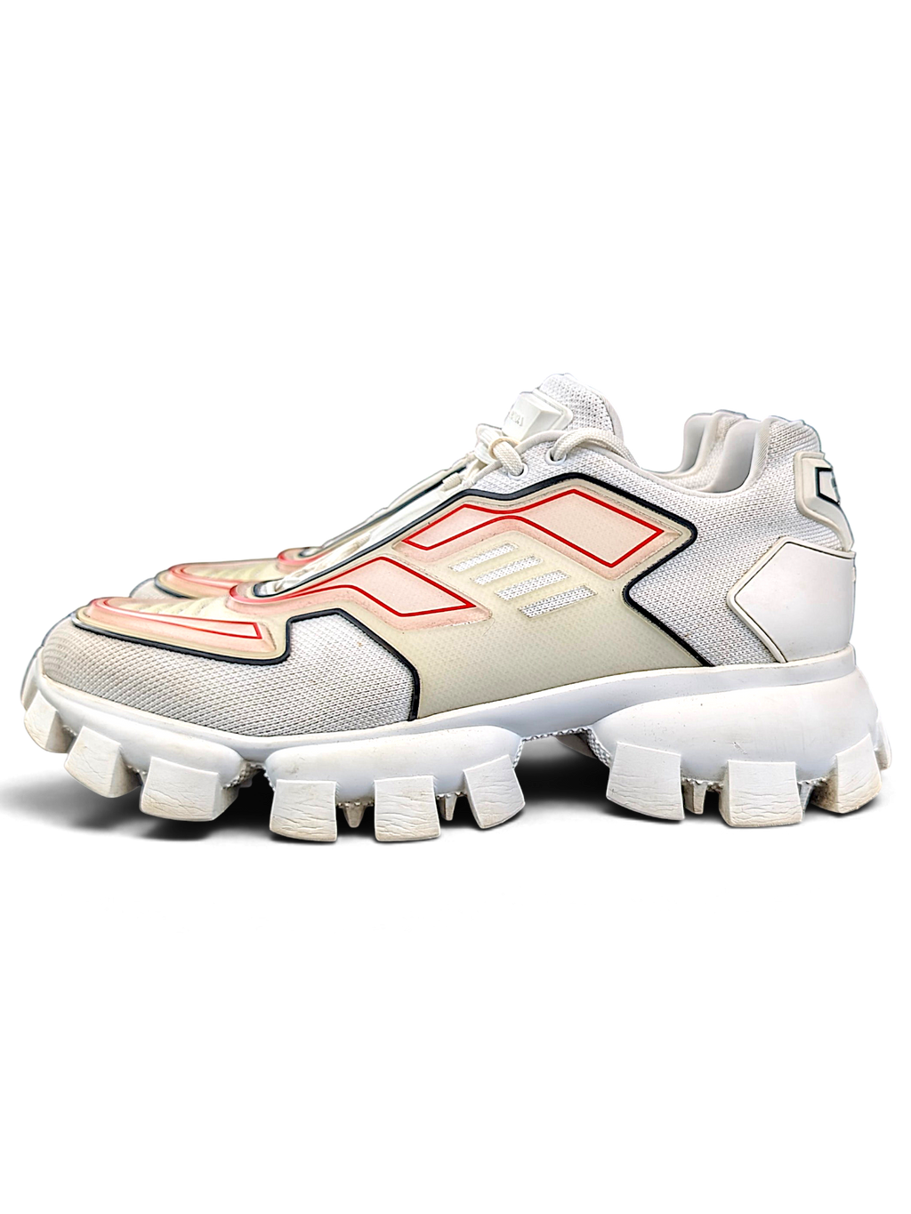 Prada Cloudbust Thunder sneakers in white, grey and red-orange, angled side view