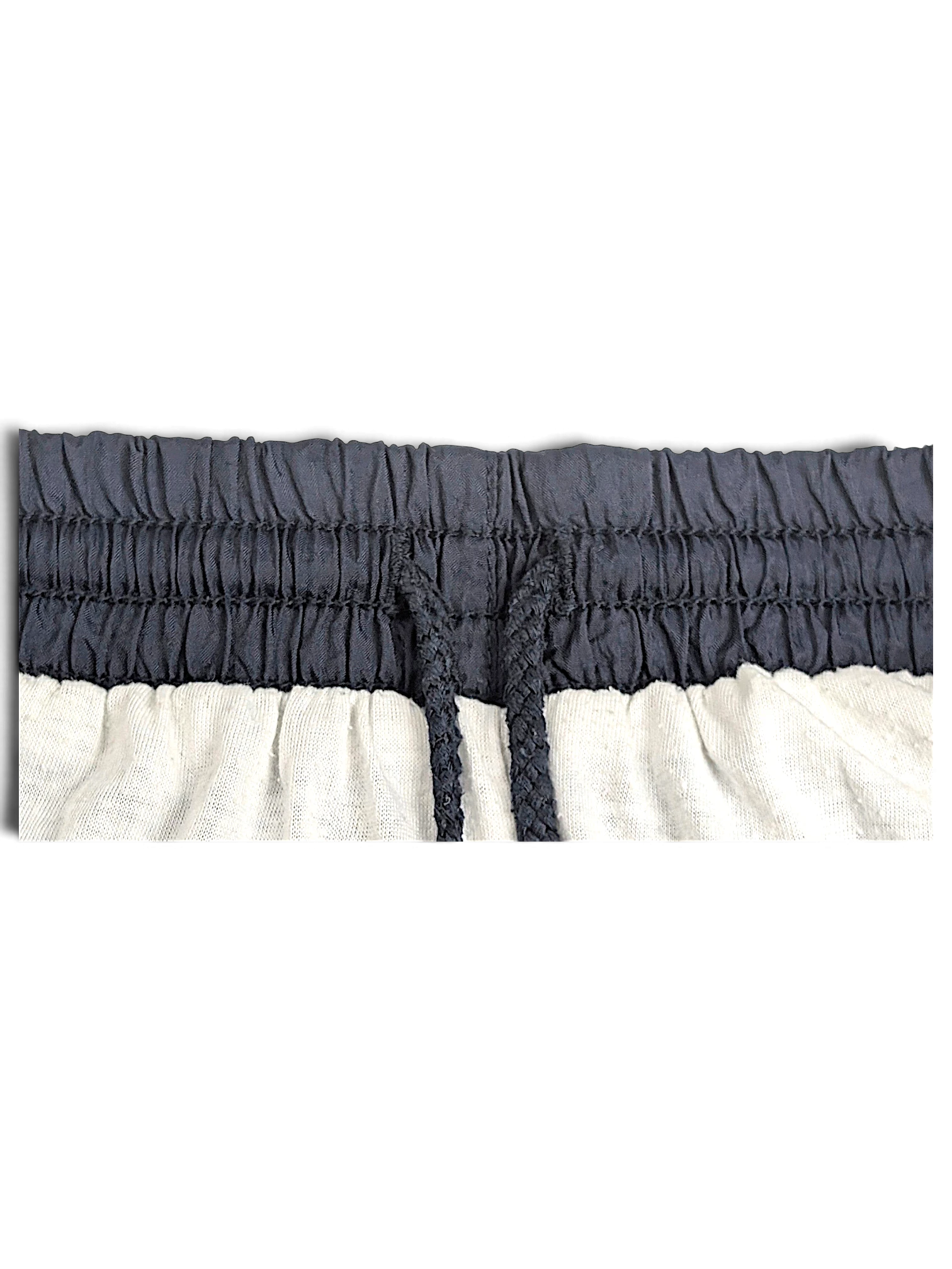 JAKE & IPI Puma black track pants featuring an elasticated waistband with a drawstring closure and white lining.