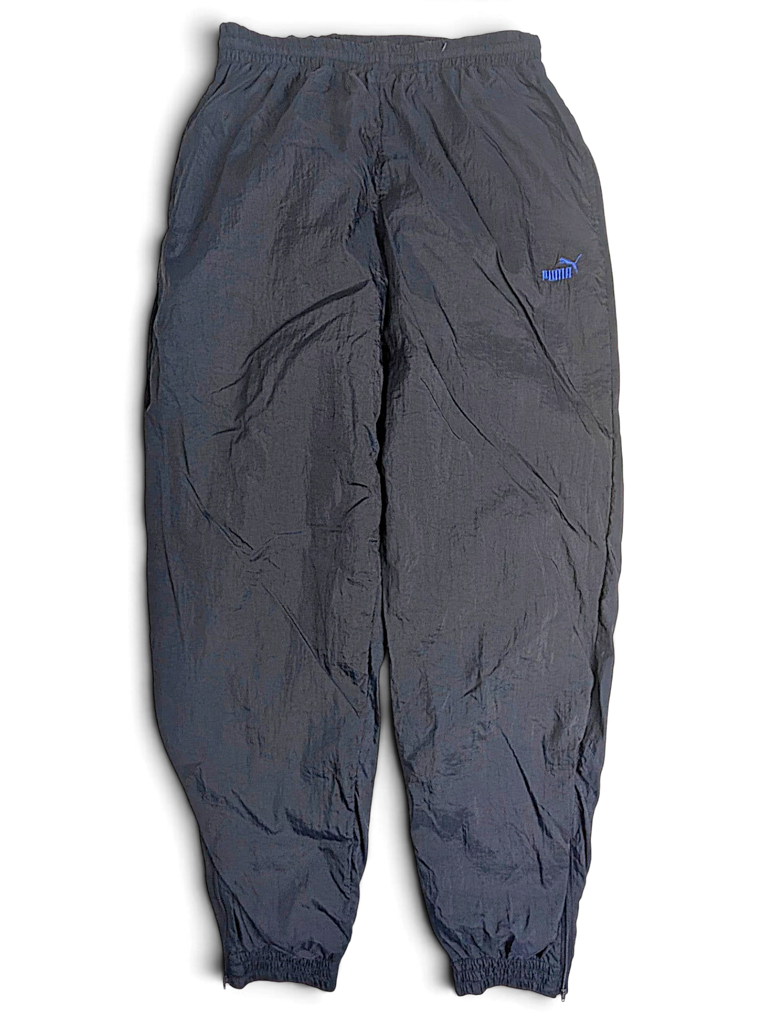 JAKE & IPI pre-owned black Puma track pants with a light blue logo, elastic waist, and lightweight fabric construction.