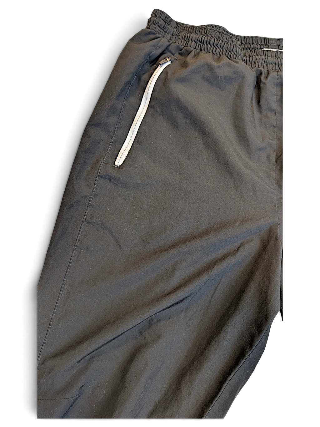 JAKE & IPI pre-owned Puma black track pants featuring white piping and an elasticated waistband