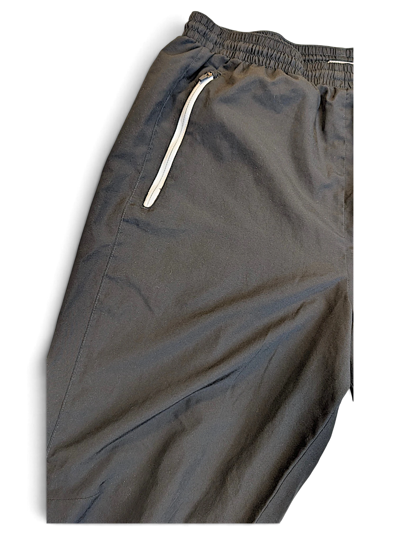 JAKE & IPI pre-owned Puma black track pants featuring white piping and an elasticated waistband