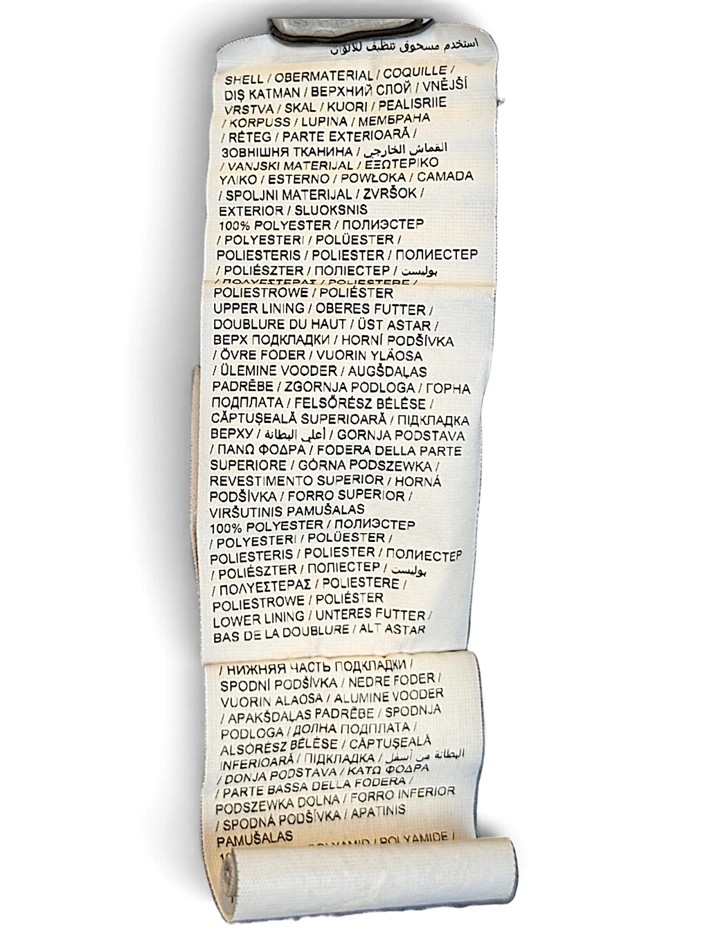 JAKE & IPI Puma track pants care and material composition label showing 100 percent polyester fabric details