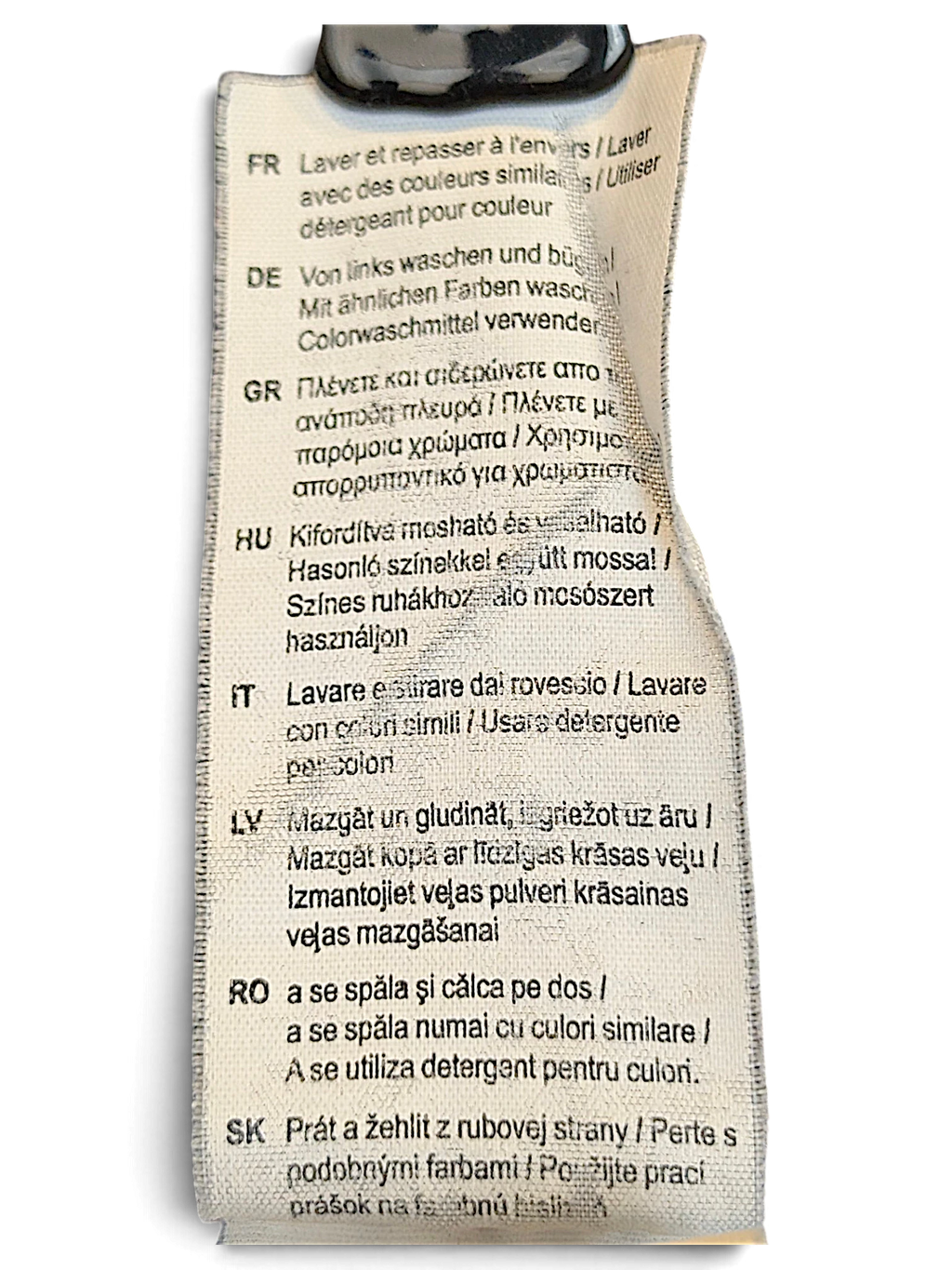 JAKE & IPI Puma track pants care label with multi-language washing and ironing instructions