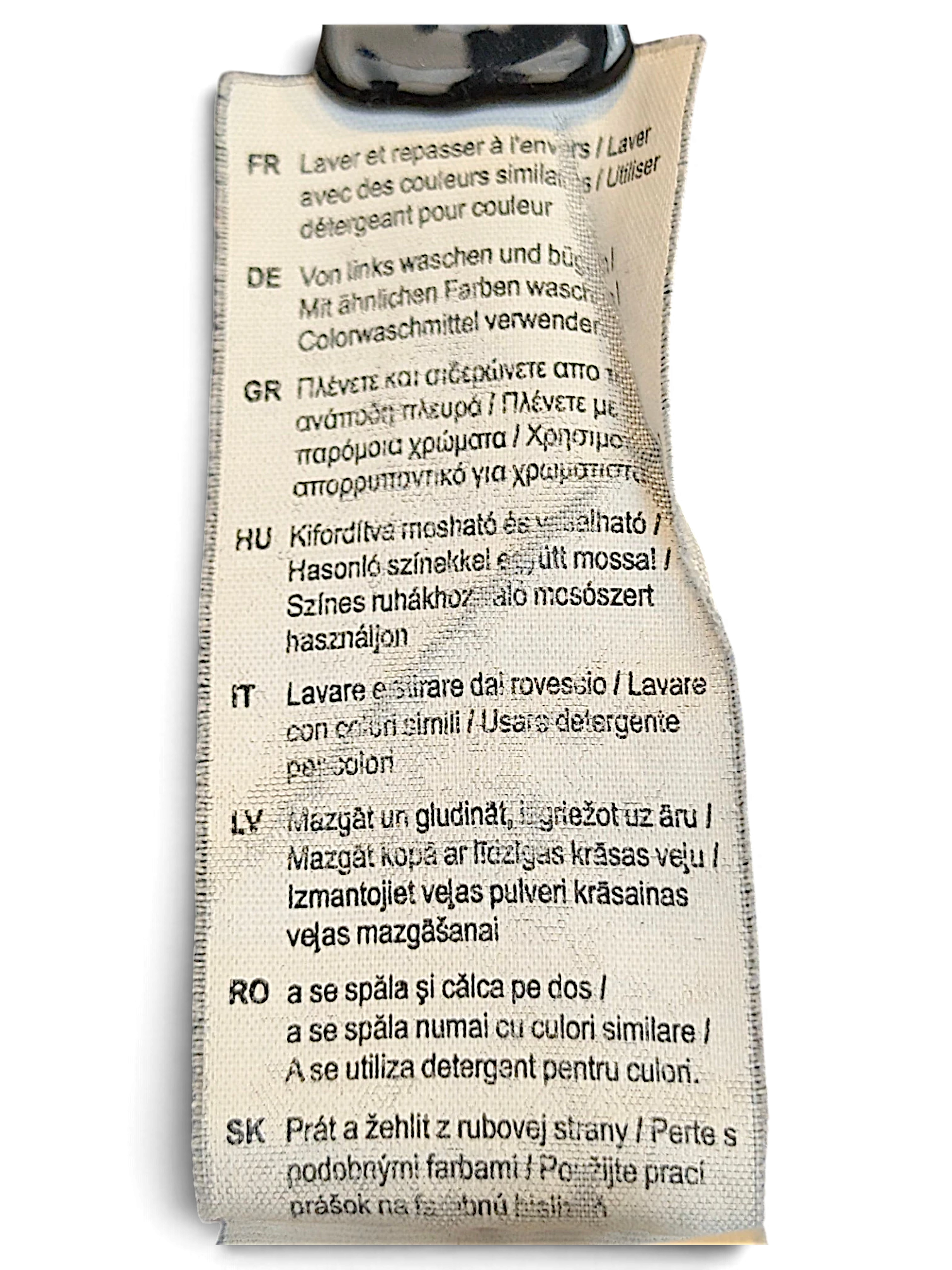JAKE & IPI Puma track pants care label with multi-language washing and ironing instructions