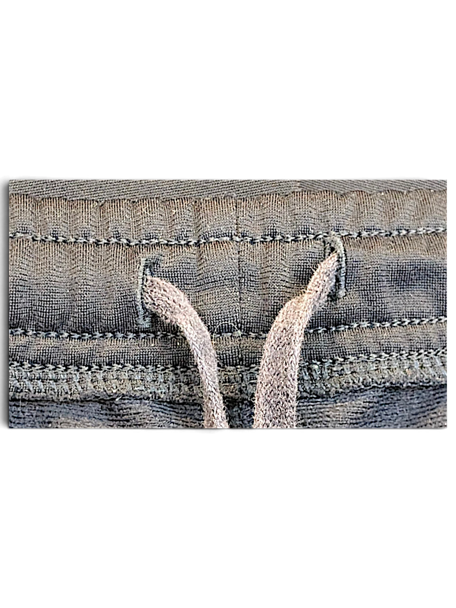 Close-up of the navy elasticated drawstring waistband on pre-owned Puma track pants from JAKE & IPI
