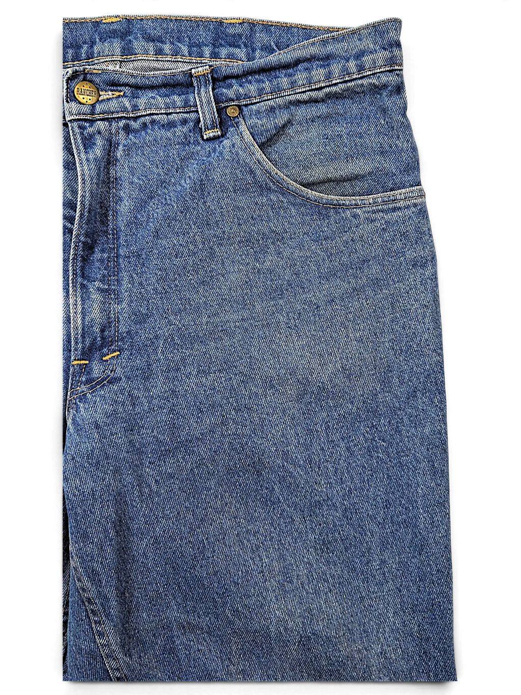 JAKE & IPI Rancher jeans in classic medium blue denim with a branded metal button closure and five-pocket design.