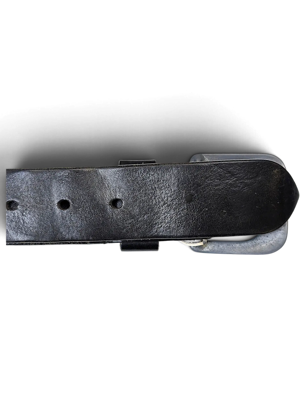 JAKE & IPI G.S. Raw black leather belt featuring a distressed metal buckle and visible stitching details.