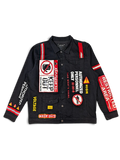 JAKE & IPI Reason black denim jacket featuring bold danger and restricted area warning patches and reflective strips