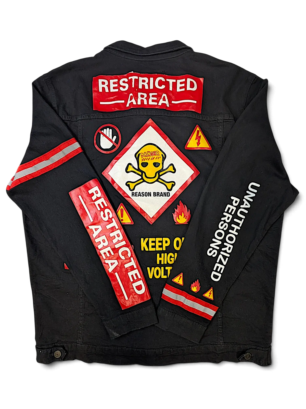 JAKE & IPI Reason black denim jacket featuring Restricted Area patches, hazard warning graphics, and reflective tape.