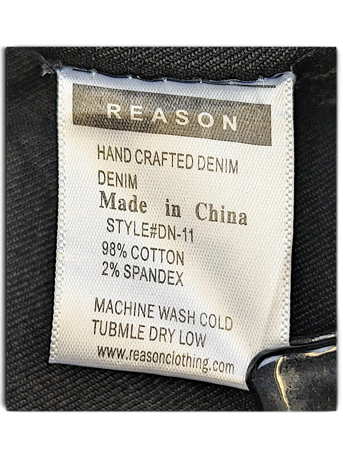 JAKE & IPI Reason denim jacket care label showing 98 percent cotton and 2 percent spandex material composition