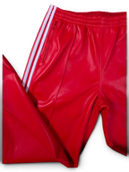 JAKE & IPI red Adidas leather pants with iconic white side stripes and zippered pockets.