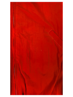 Close-up of a red JAKE & IPI Balenciaga x Adidas jacket featuring a front zipper and textured fabric detail.