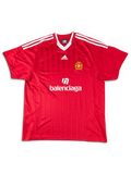 JAKE & IPI red Balenciaga x Adidas collaborative soccer jersey with white stripes and logo detailing