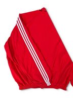 JAKE & IPI red Balenciaga x Adidas track jacket with iconic white three-stripe sleeve detailing