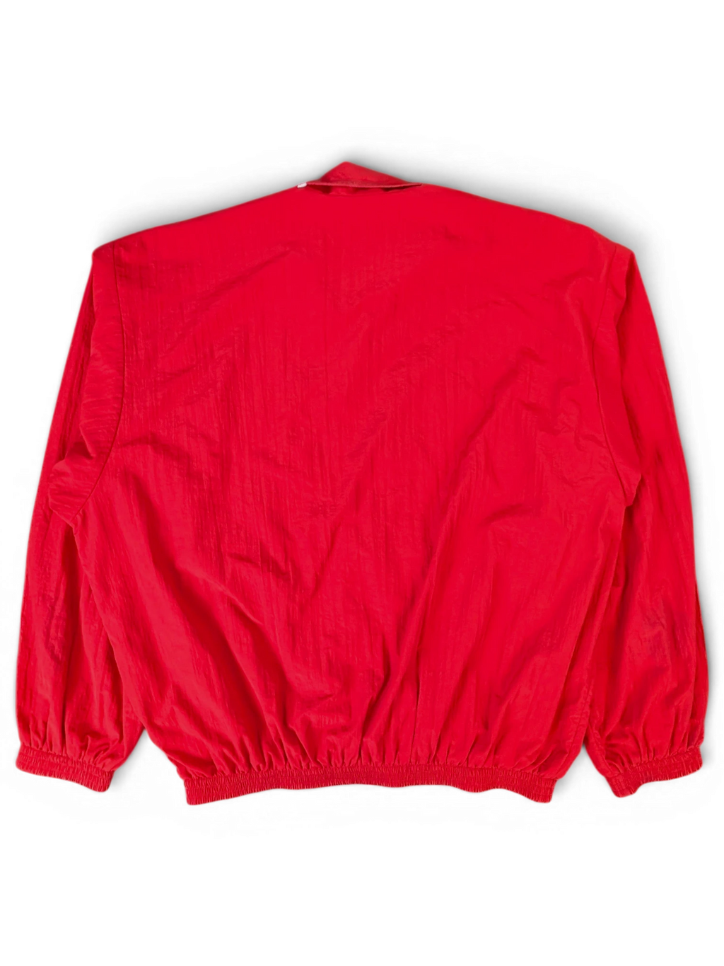 JAKE & IPI red Balenciaga x Adidas windbreaker jacket, back view showing crinkled nylon fabric and elasticated hem.