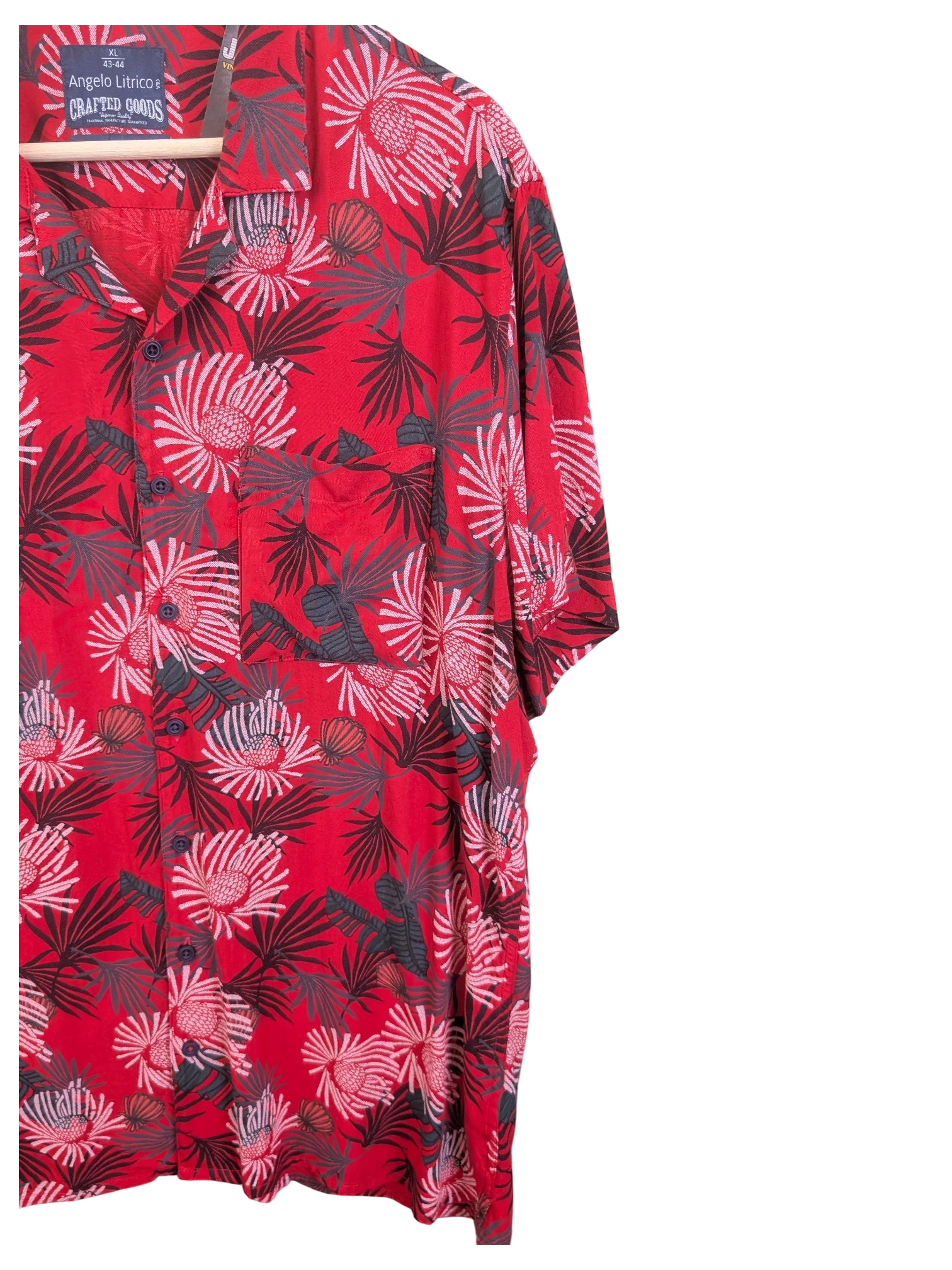 JAKE & IPI Angelo Litrico red Hawaiian shirt with a dark grey tropical floral print, short sleeves, and chest pocket.