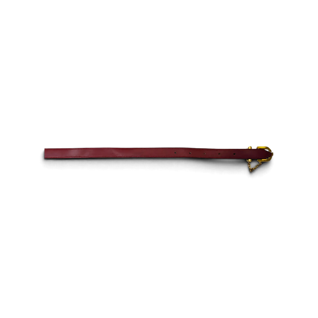 JAKE & IPI red leather belt featuring a decorative golden chain and buckle hardware on a white background