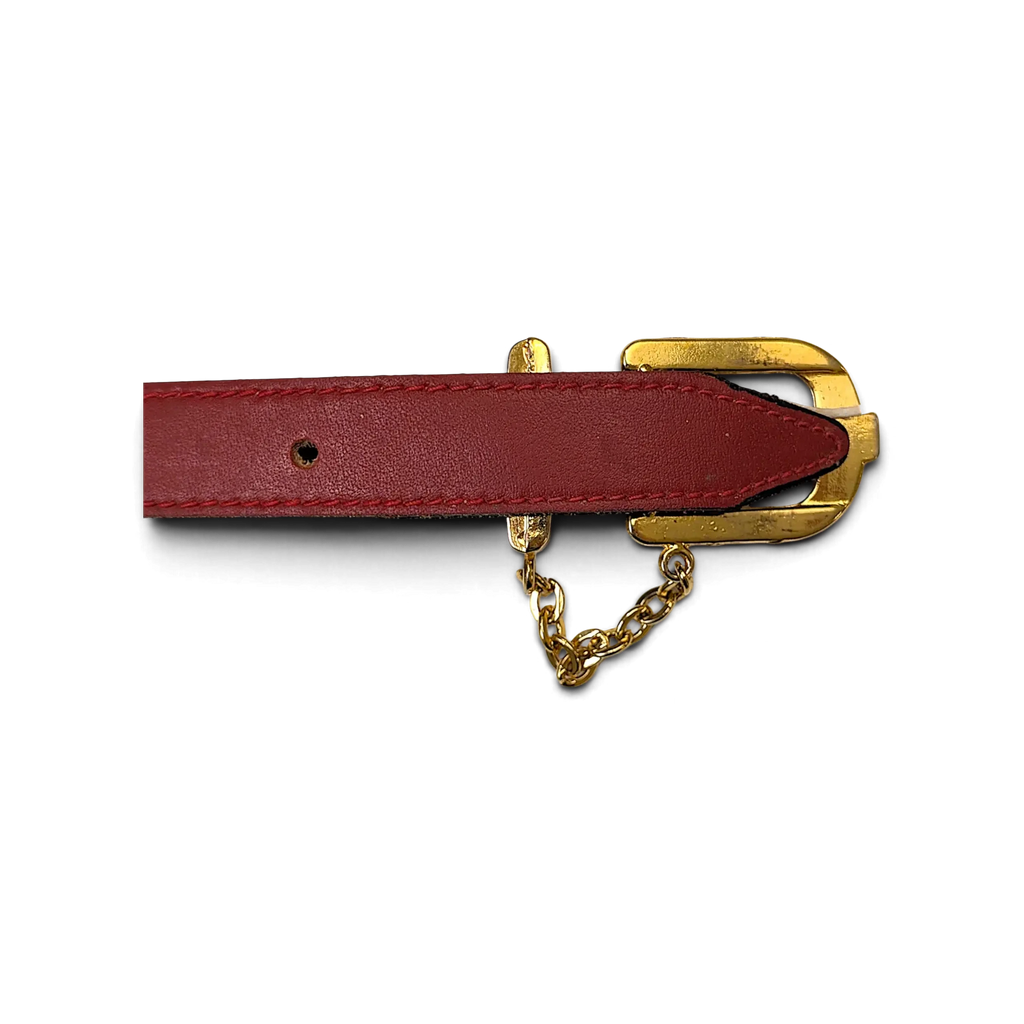 JAKE & IPI red leather belt featuring a polished gold-tone buckle and decorative chain hardware detail.