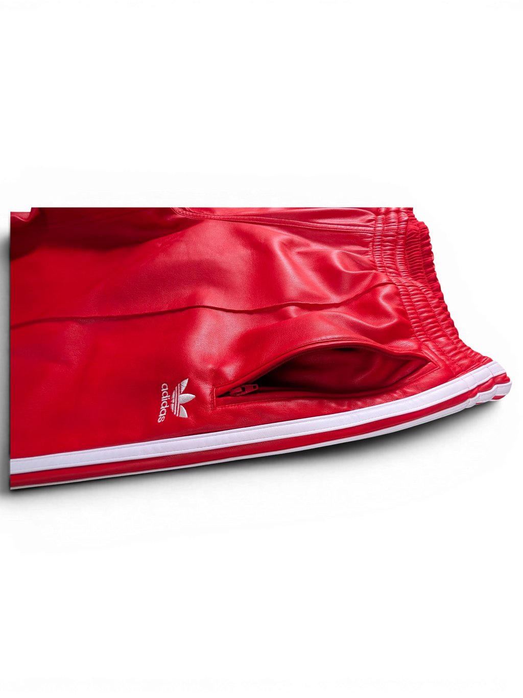 JAKE & IPI Adidas red leather pants with white side stripes and zippered pocket detail