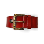 JAKE & IPI red leather belt featuring a gold-tone buckle with decorative silver studs held in a hand.