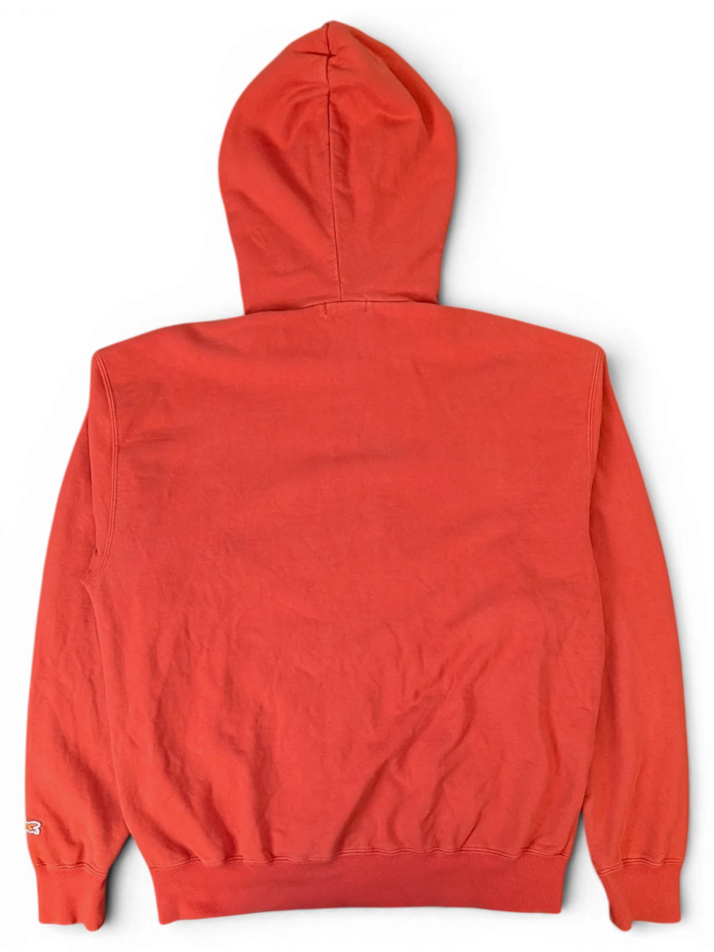 Back view of a plain red JAKE & IPI Icecream zip hoodie with a hood, isolated on a black background.