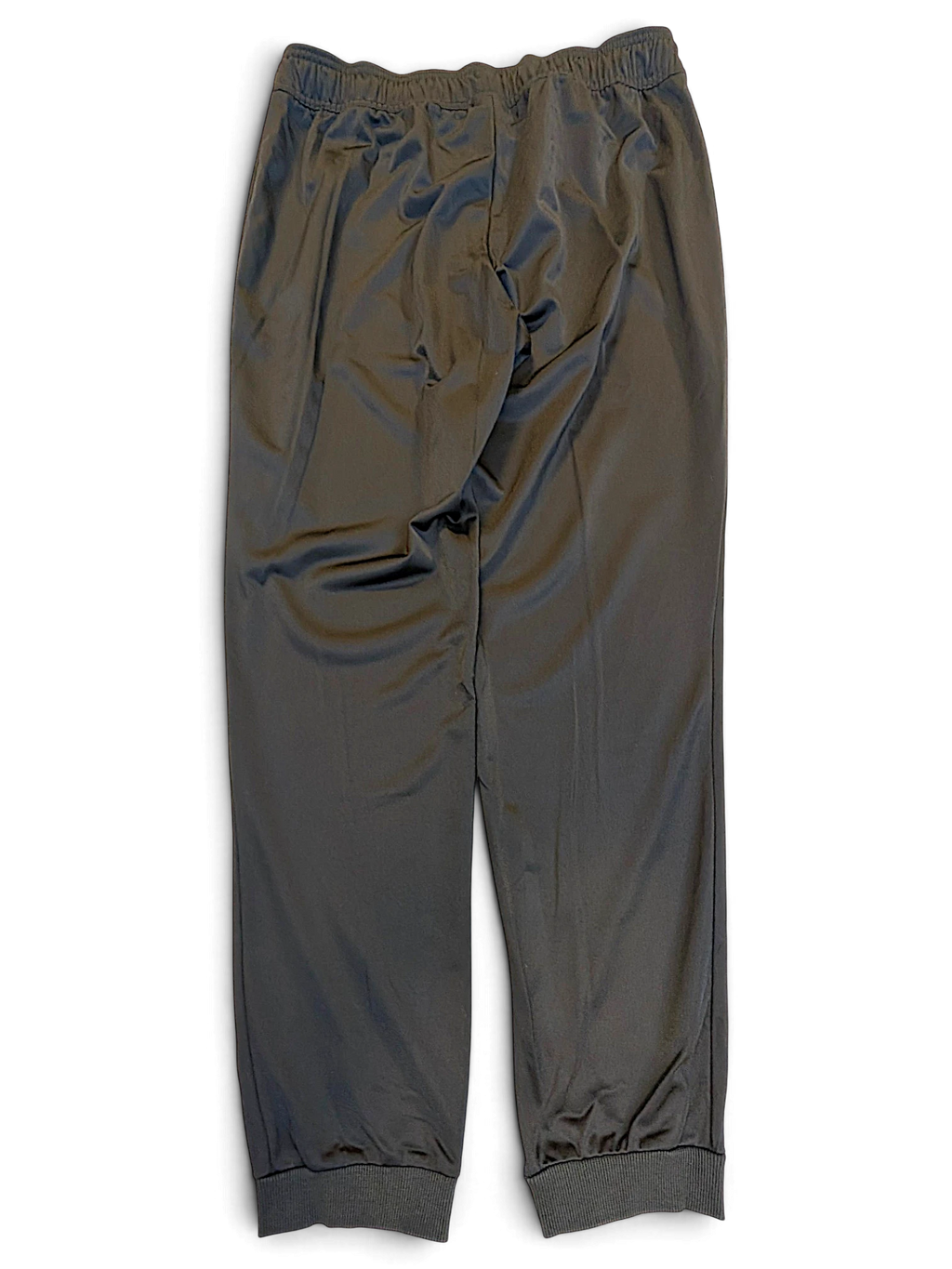 JAKE & IPI pre-owned Reebok black polyester track pants with cuffed ankles and a tapered fit.