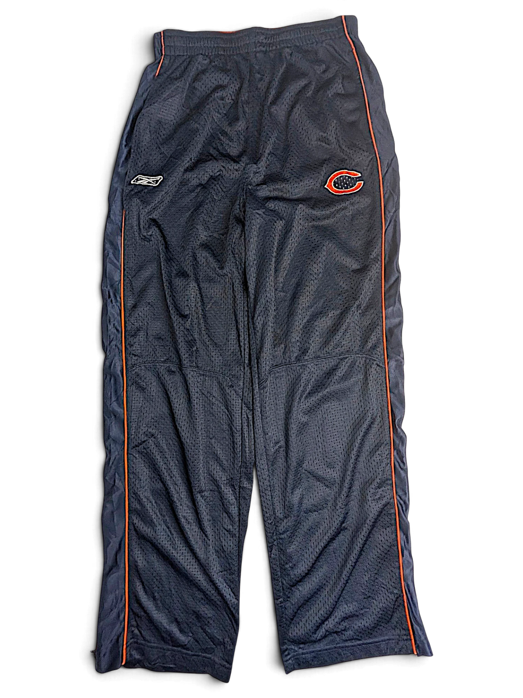 JAKE & IPI pre-owned Reebok navy blue Chicago Bears NFL track pants for kids with orange piping and mesh texture.