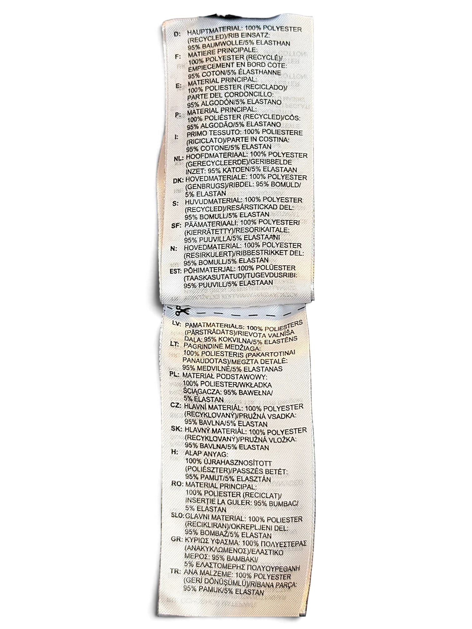 JAKE & IPI Reebok track pants care label detailing polyester composition and recycled material information