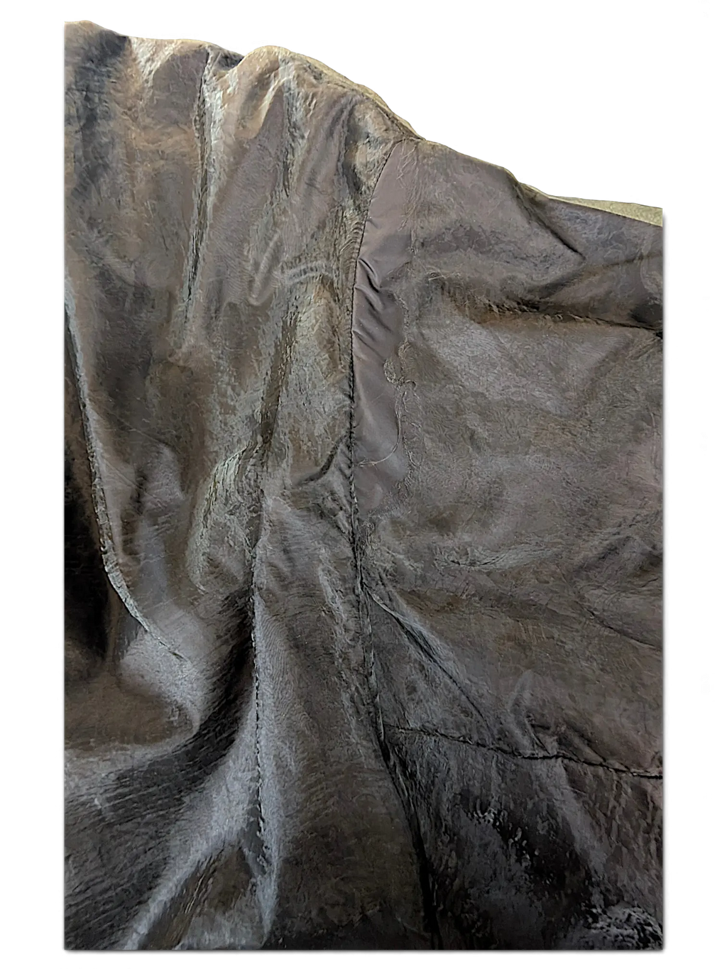Close-up of JAKE & IPI Rick Owens bomber jacket featuring dark grey textured fabric with detailed seam stitching.