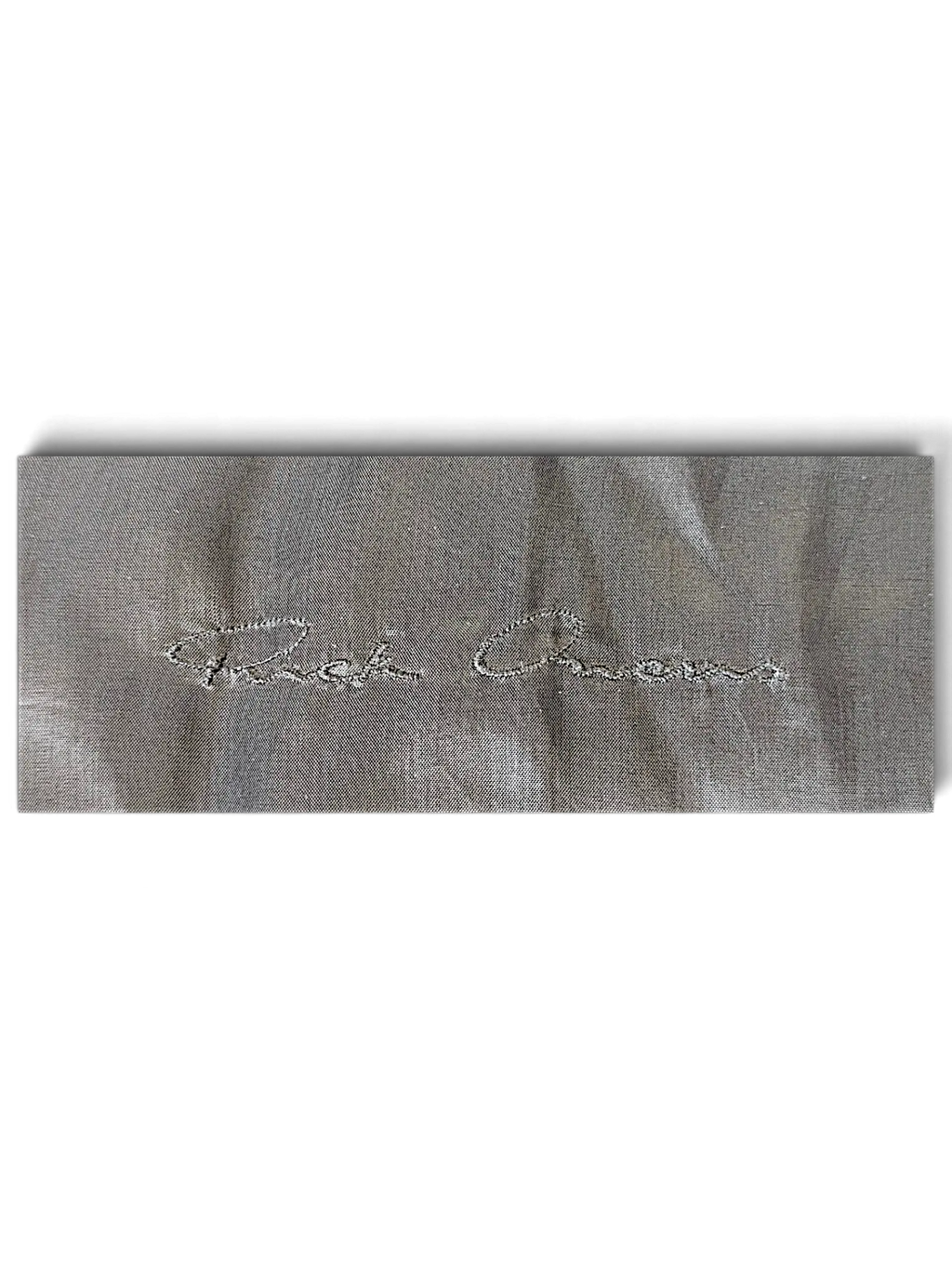 JAKE & IPI Rick Owens bomber jacket interior label with silver embroidered logo on grey fabric