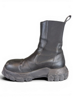 JAKE & IPI Rick Owens Beatle Bozo Tractor boots in metallic black leather with an oversized lug sole and side panels.