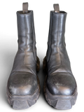 JAKE & IPI Rick Owens Beatle Bozo Tractor boots in metallic black leather with an oversized lug sole.