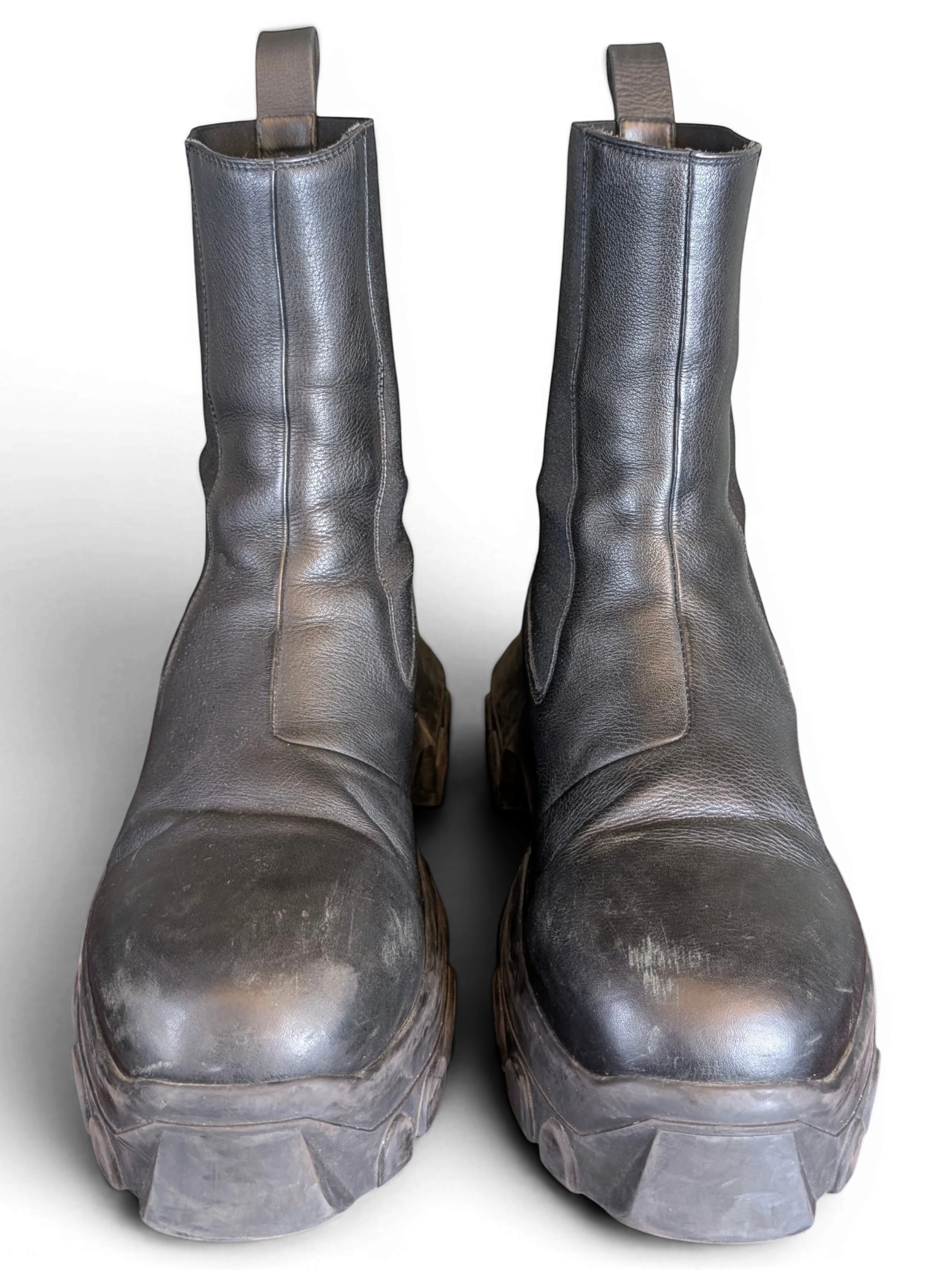 JAKE & IPI Rick Owens Beatle Bozo Tractor boots in metallic black leather with an oversized lug sole.