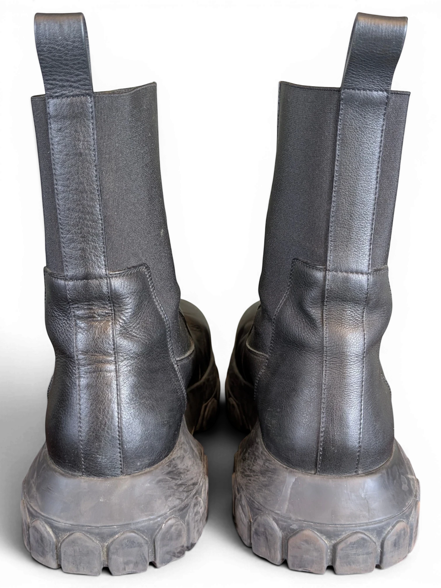 JAKE & IPI Rick Owens Beatle Bozo Tractor boots in metallic black leather with oversized lug soles, rear view.
