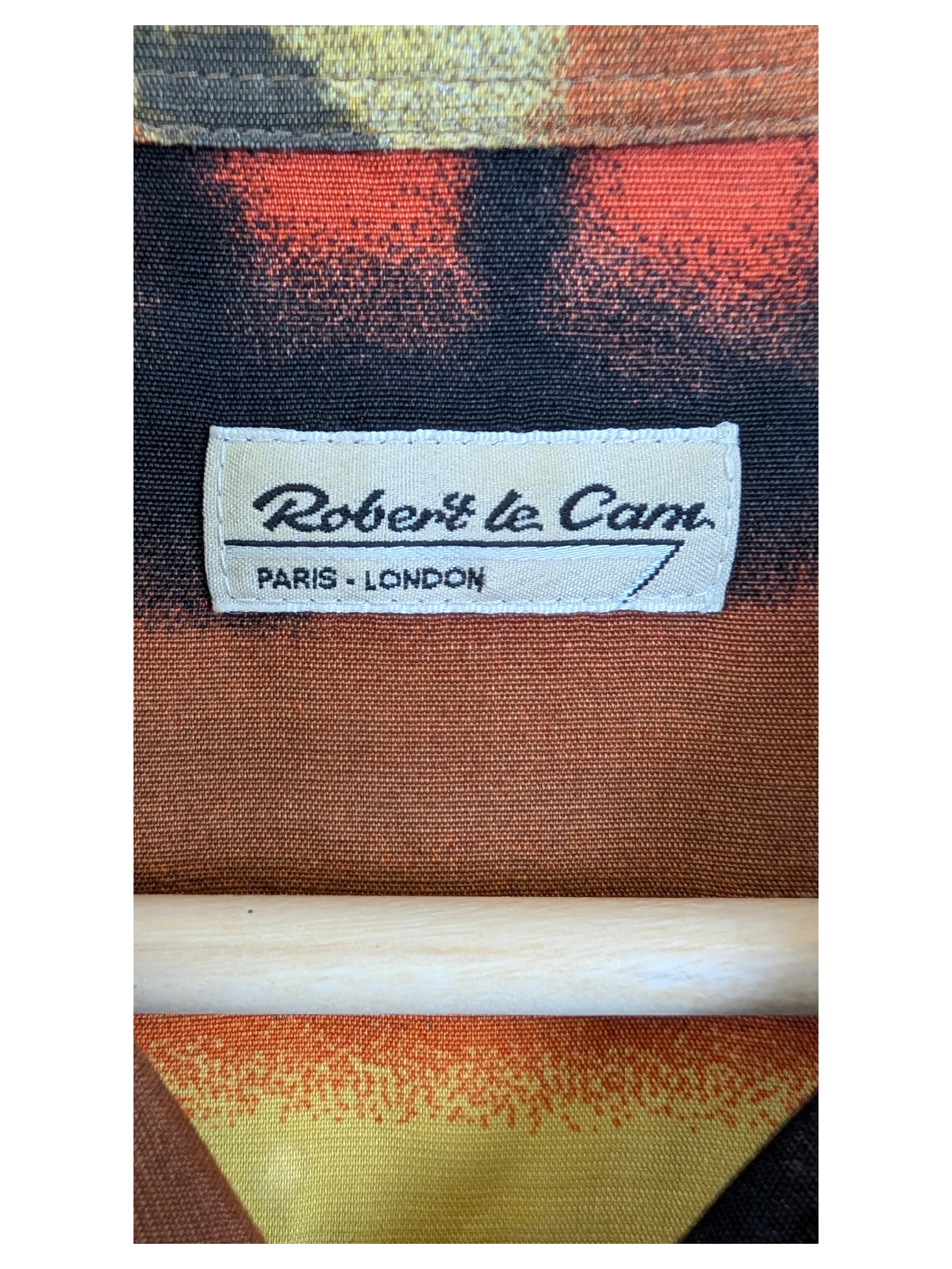 JAKE & IPI Robert Le Cam Hawaiian shirt featuring a vibrant orange and yellow abstract print on textured fabric