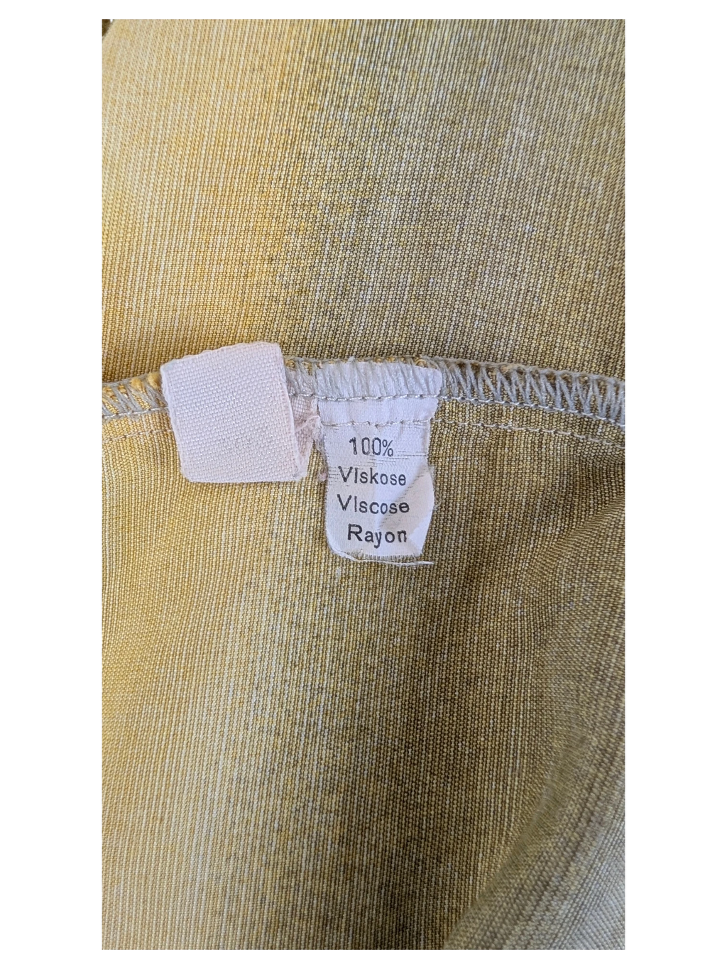 JAKE & IPI Robert Le Cam Hawaiian shirt label showing 100% viscose rayon material composition in yellow fabric