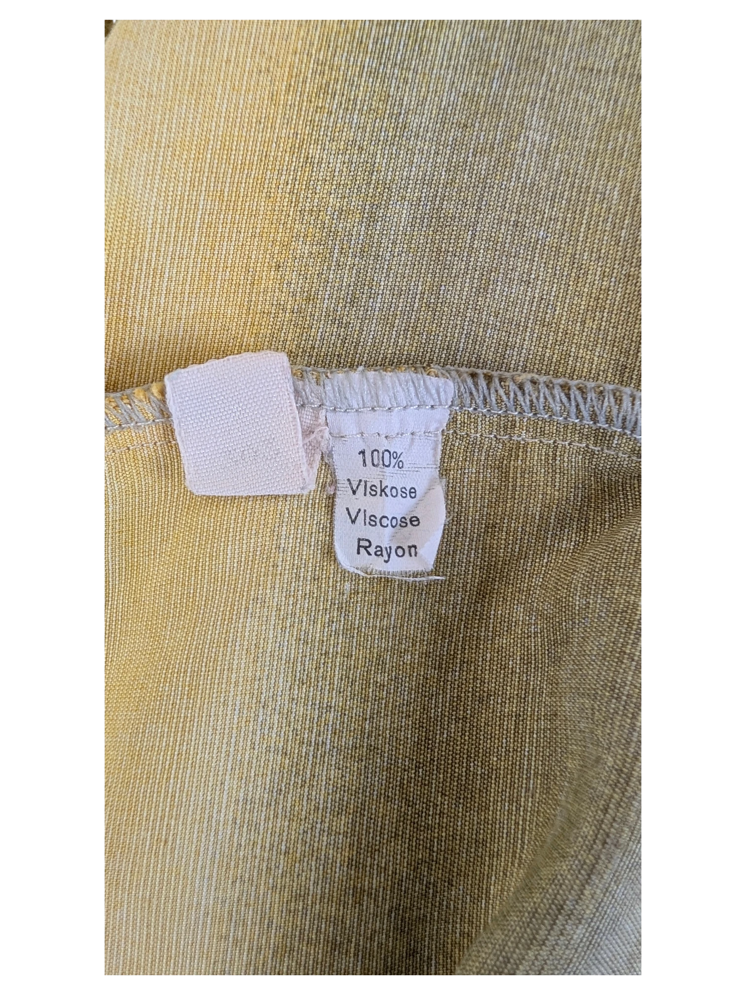 JAKE & IPI Robert Le Cam Hawaiian shirt label showing 100% viscose rayon material composition in yellow fabric