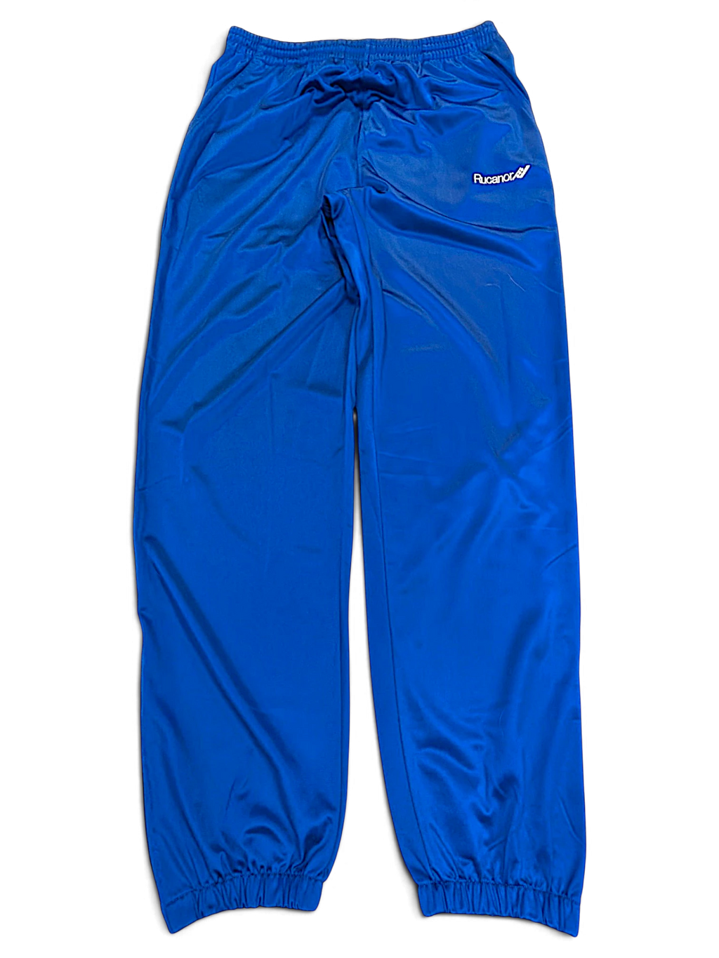 JAKE & IPI pre-owned Rucanor royal blue track pants with elastic waist and retro sportswear styling.