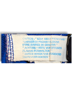JAKE & IPI Rucanor track pants care label with multilingual fire safety warning text on a royal blue fabric background