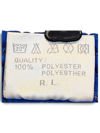 JAKE & IPI Rucanor track pants care label showing 100% polyester composition and laundry instructions
