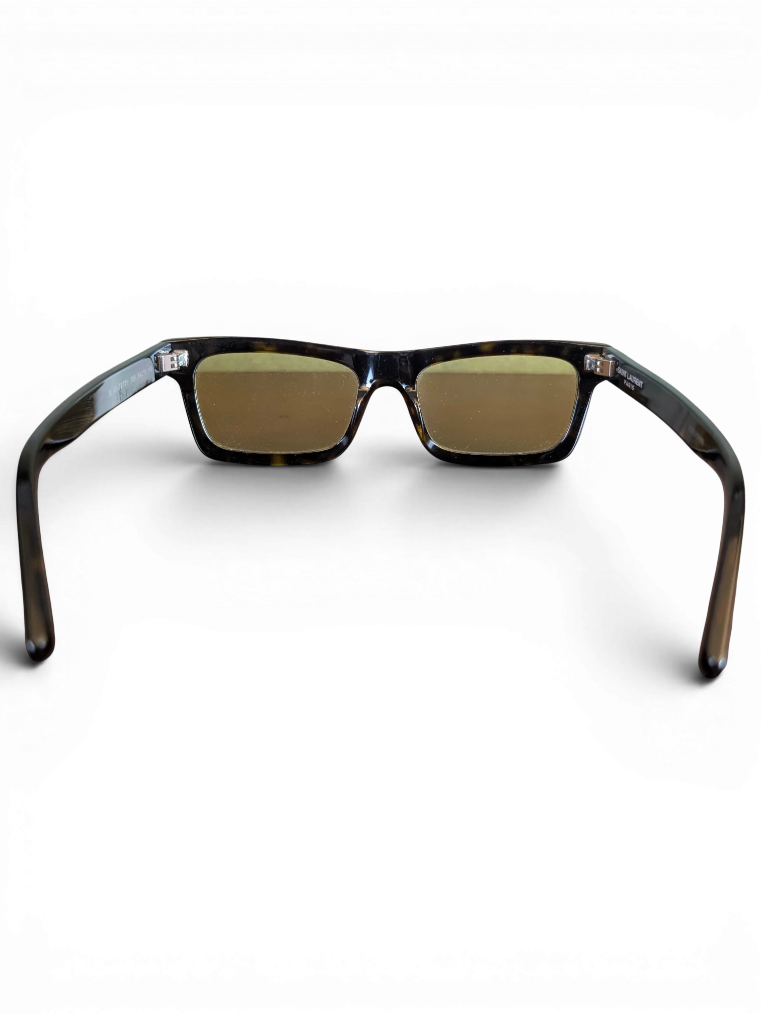 JAKE & IPI Saint Laurent SL461 Betty sunglasses featuring a tortoiseshell frame and rectangular lenses, rear view.