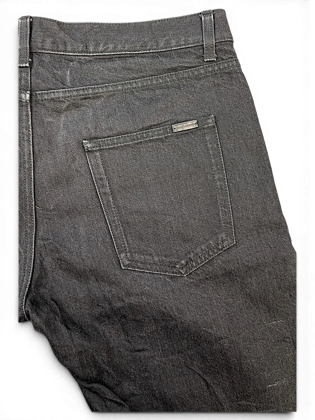 JAKE & IPI Saint Laurent black denim jeans featuring a back pocket with a metallic logo plaque