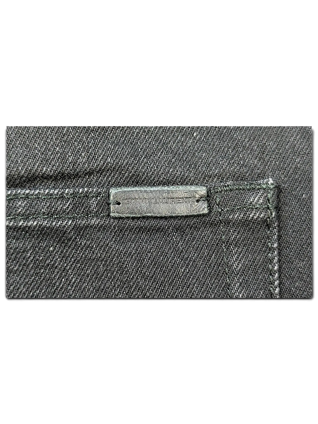 JAKE & IPI Saint Laurent black denim jeans featuring a branded leather patch on the back pocket