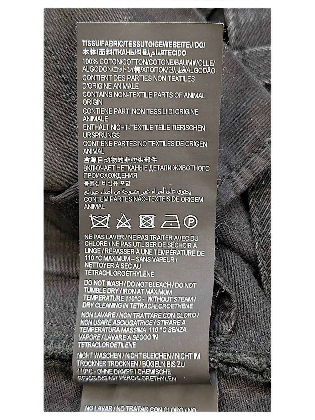 JAKE & IPI Saint Laurent jeans black fabric care label with multilingual washing instructions