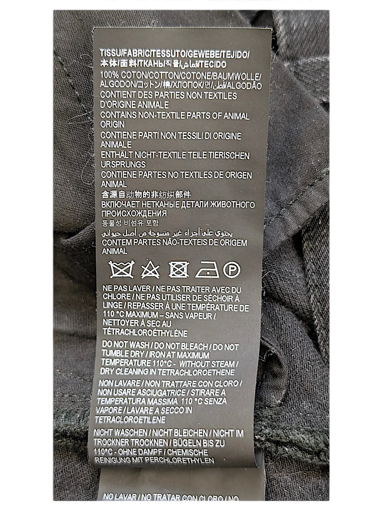 JAKE & IPI Saint Laurent jeans black fabric care label with multilingual washing instructions