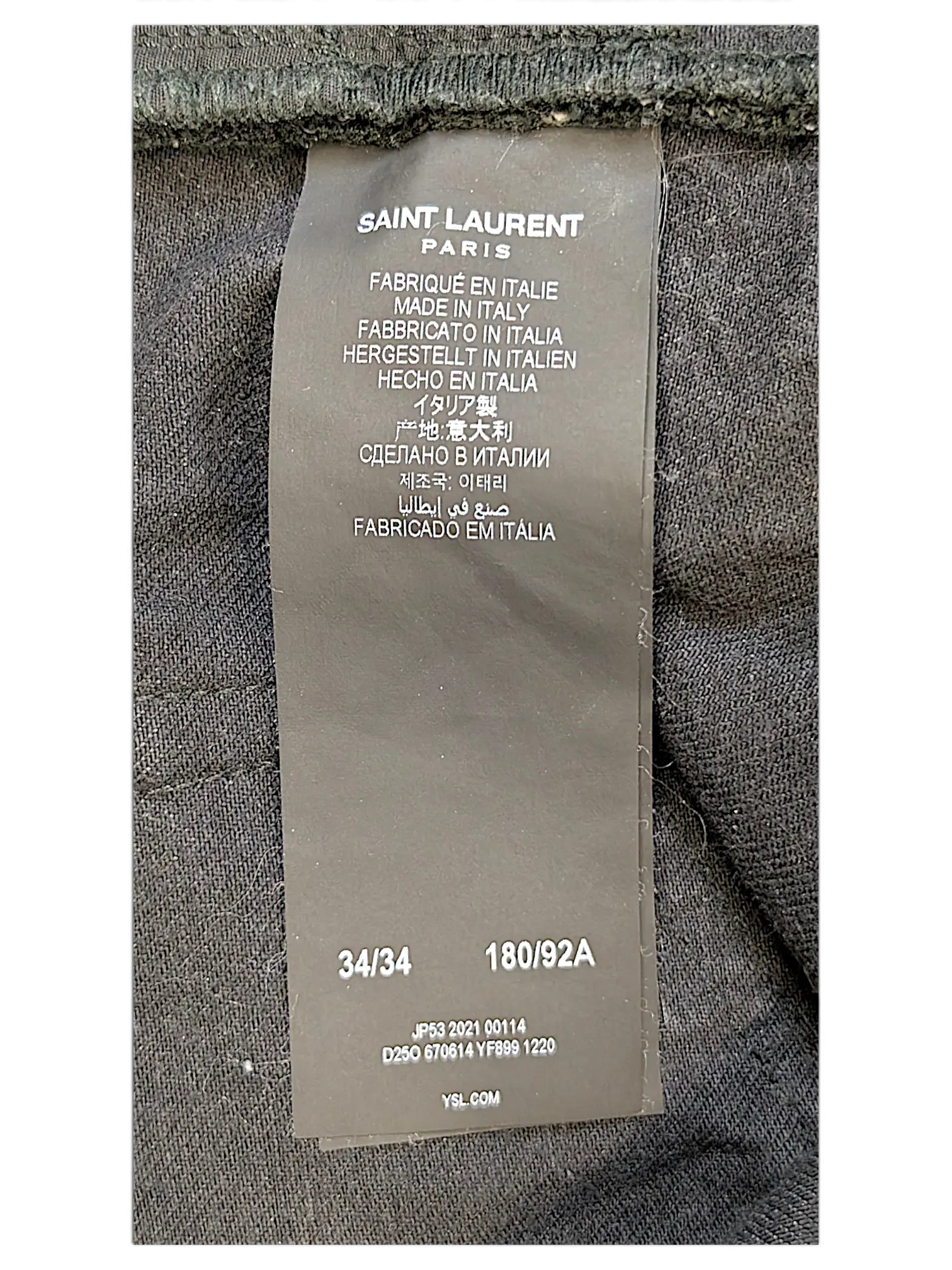 JAKE & IPI Saint Laurent jeans black fabric care label with size 34/34 and 180/92A details