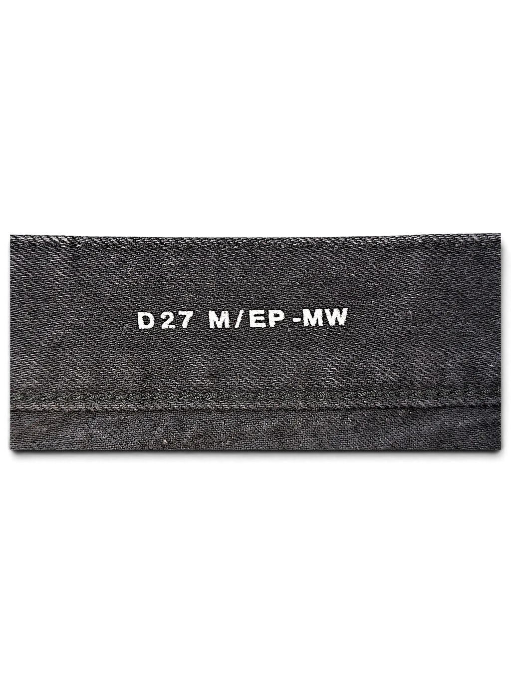 JAKE & IPI Saint Laurent jeans interior fabric label with white text detailing size and model information