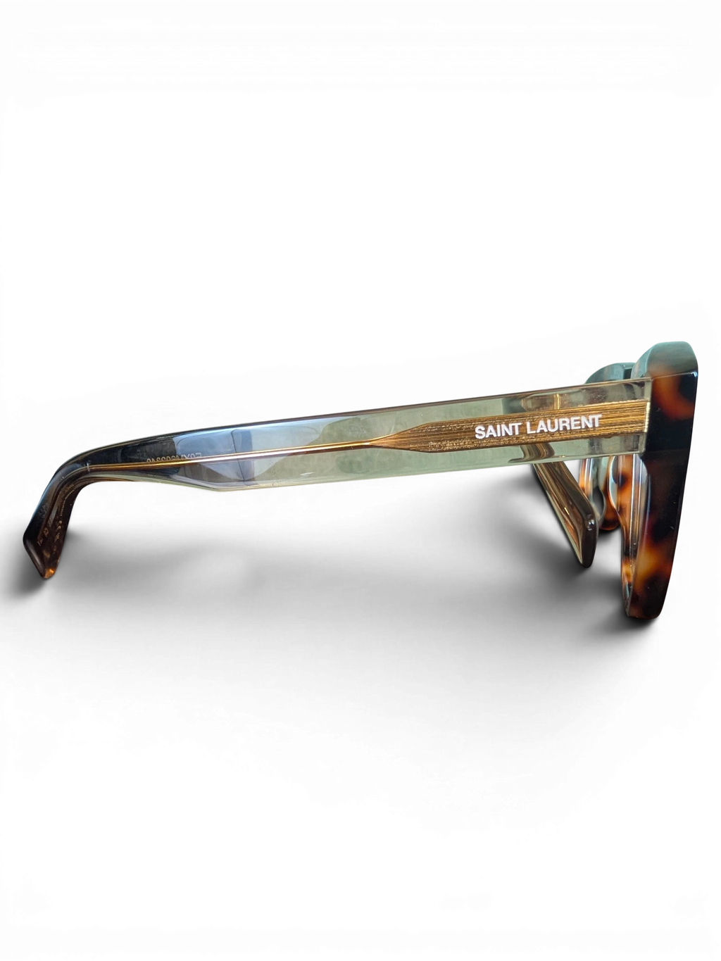 JAKE & IPI Saint Laurent SL558 sunglasses with a tortoiseshell frame and gold logo detail on the temple