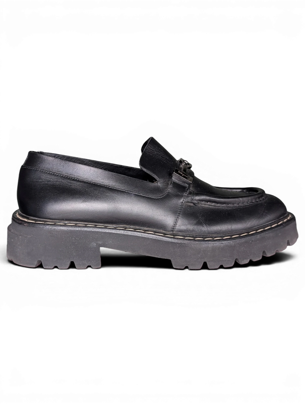 JAKE & IPI Salvatore Ferragamo black leather loafers featuring metal hardware and a chunky lug rubber sole.